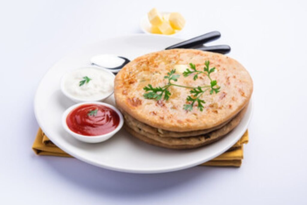 Front view of gobi paratha in a white plate