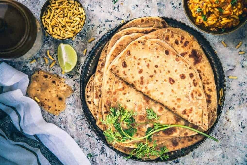 Front view of namak paratha in a plate