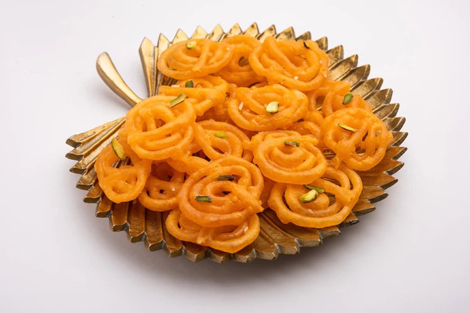 close-up view of kesari jalebi in a plate